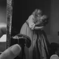 Two People Exchanging Saliva